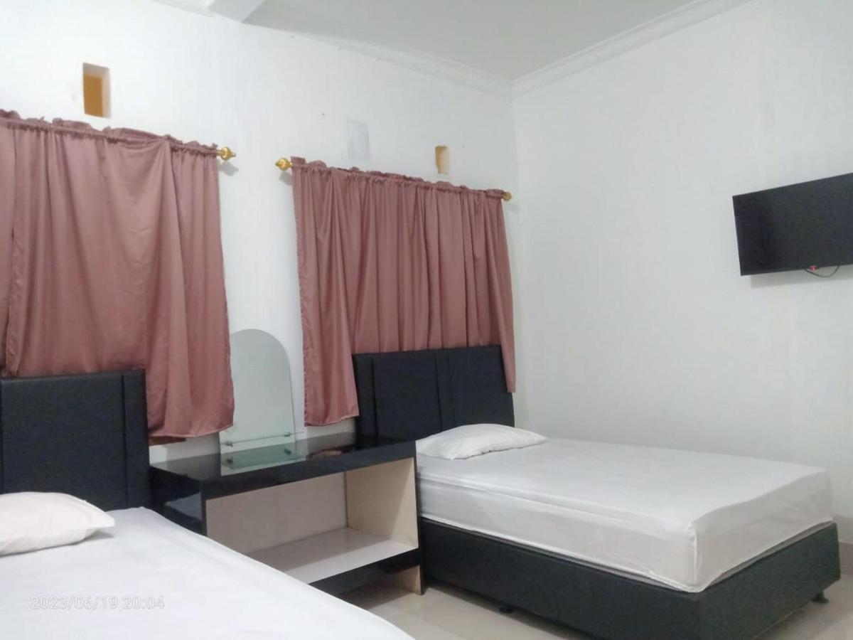 Permata Homestay Kotamobagu Mitra Reddoorz Kültér fotó